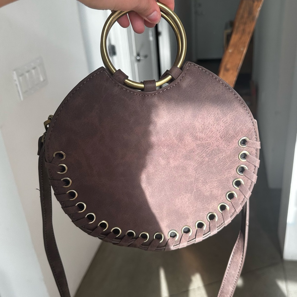 Anthropologie suede circle purse with O ring handle.